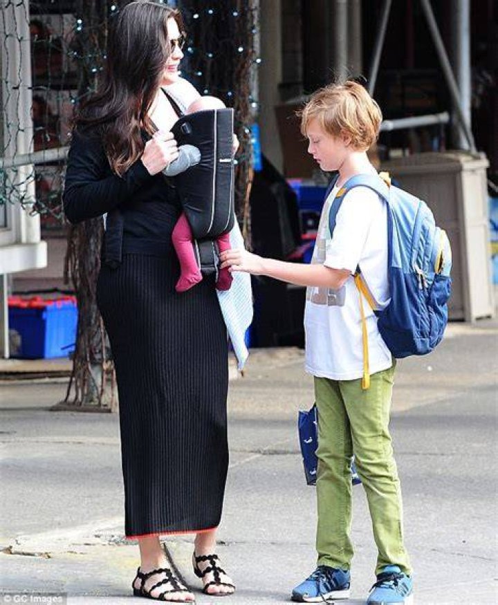 Liv Tyler carries newborn Sailor in a sling with son Milo in New York