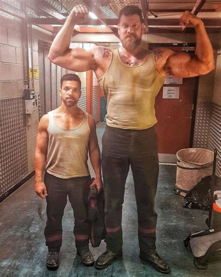Standing Next to a Giant: Tallest Bodybuilder in the World Stuns Fitness Worldat Indiana Jone