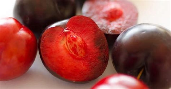 Why are some plums red inside?